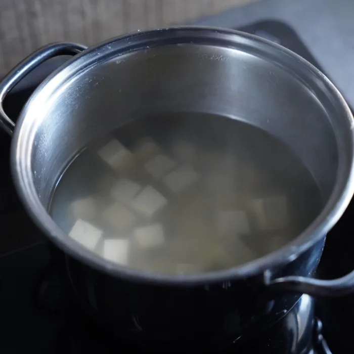 Vegan palak paneer, step 5. The tofu is briefly boiled.
