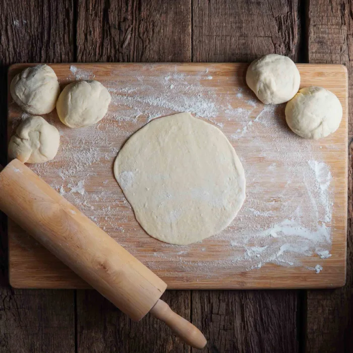 Vegan naan, step 4a, shaping the dough into balls and rolling it out
