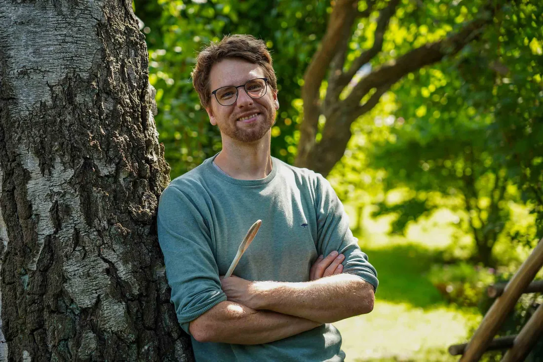 Summer portrait of me in the garden on a sunny day, wooden spoon in hand.